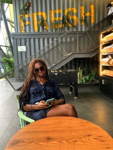 Multi-talented individual - Thia mindlessly scrolling through her phone.