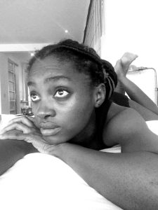 Multi-talented individual - Thia looking listlessly from her bed.